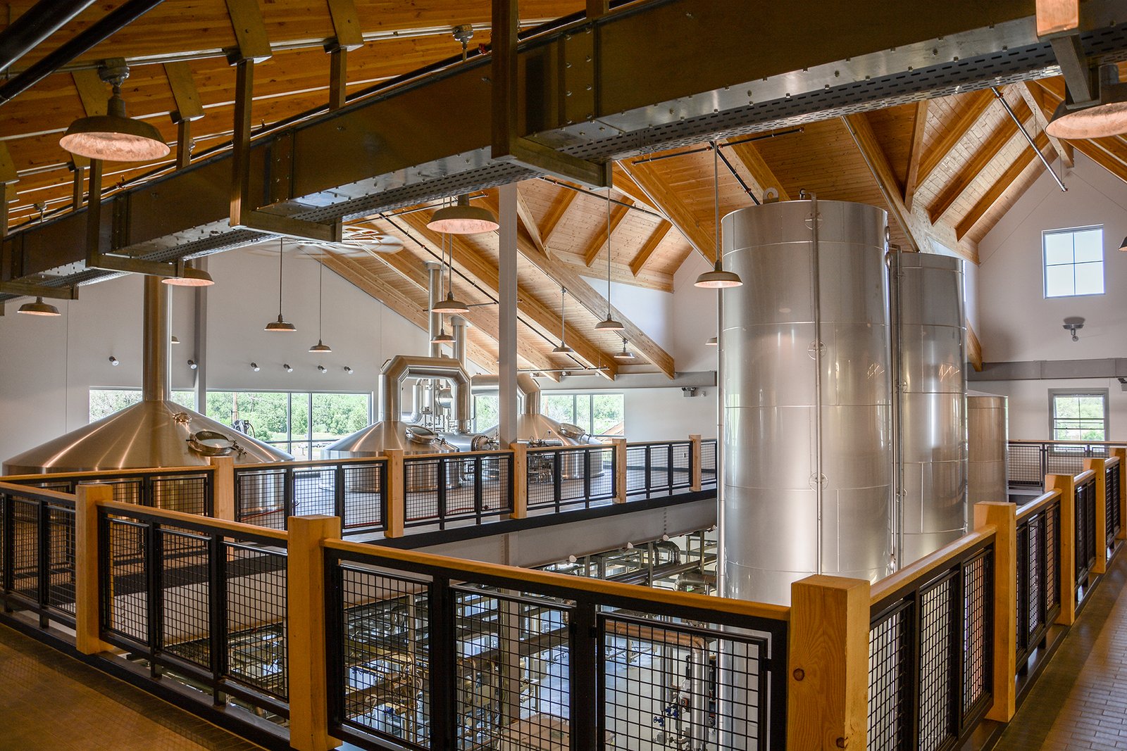 Inside a craft brewery, among the brewing tanks
