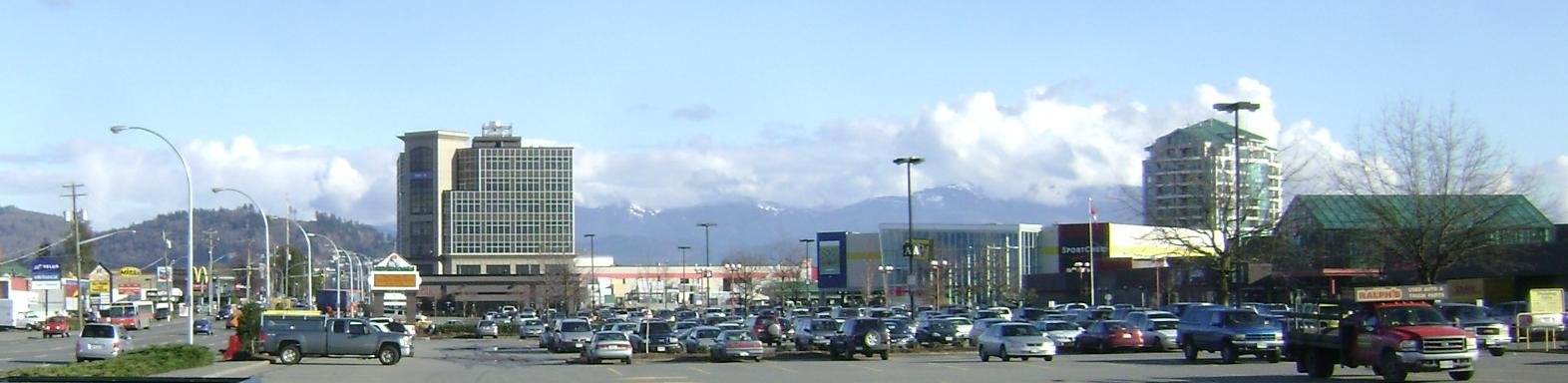 Downtown Abbotsford with mountains rising behind the rooftops (uploader-described; not Essendene Ave specifically)