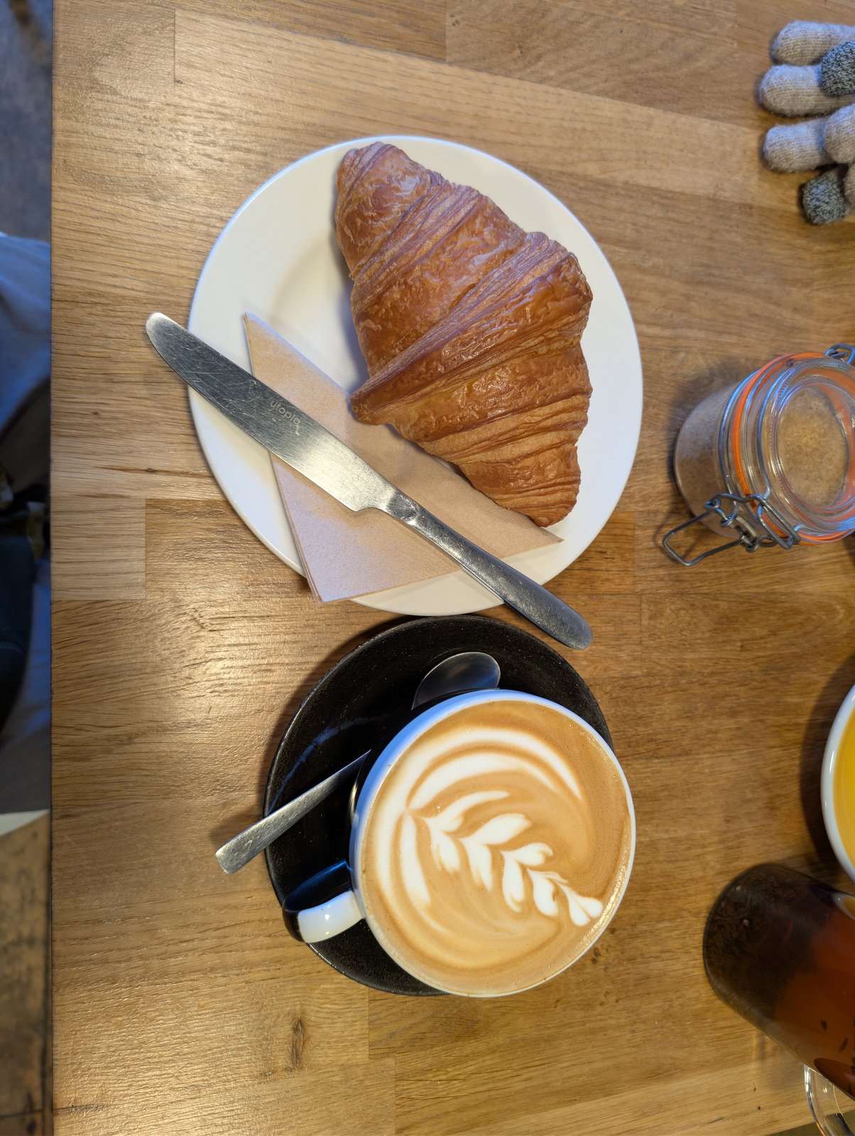 Coffee and a croissant on a café table