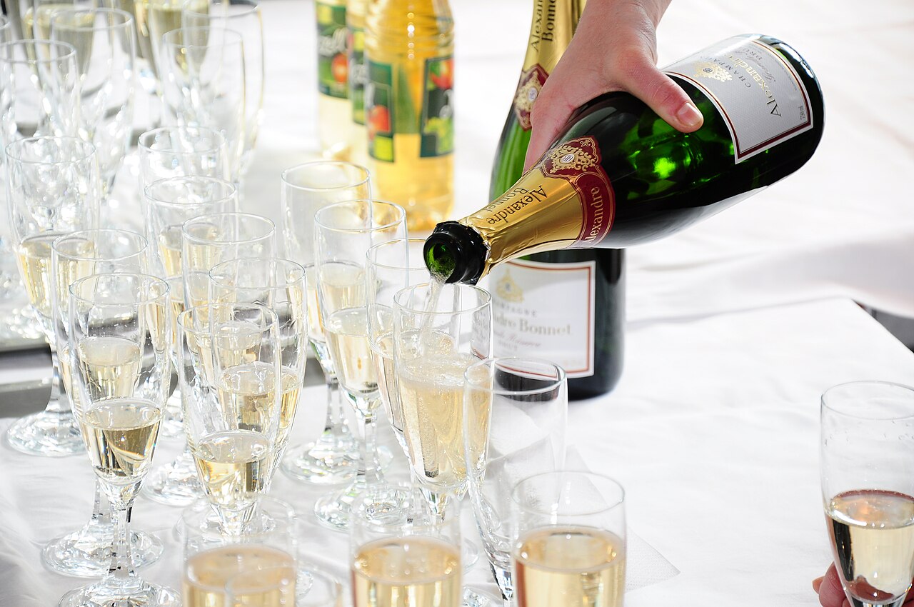 Champagne being poured into tasting flutes
