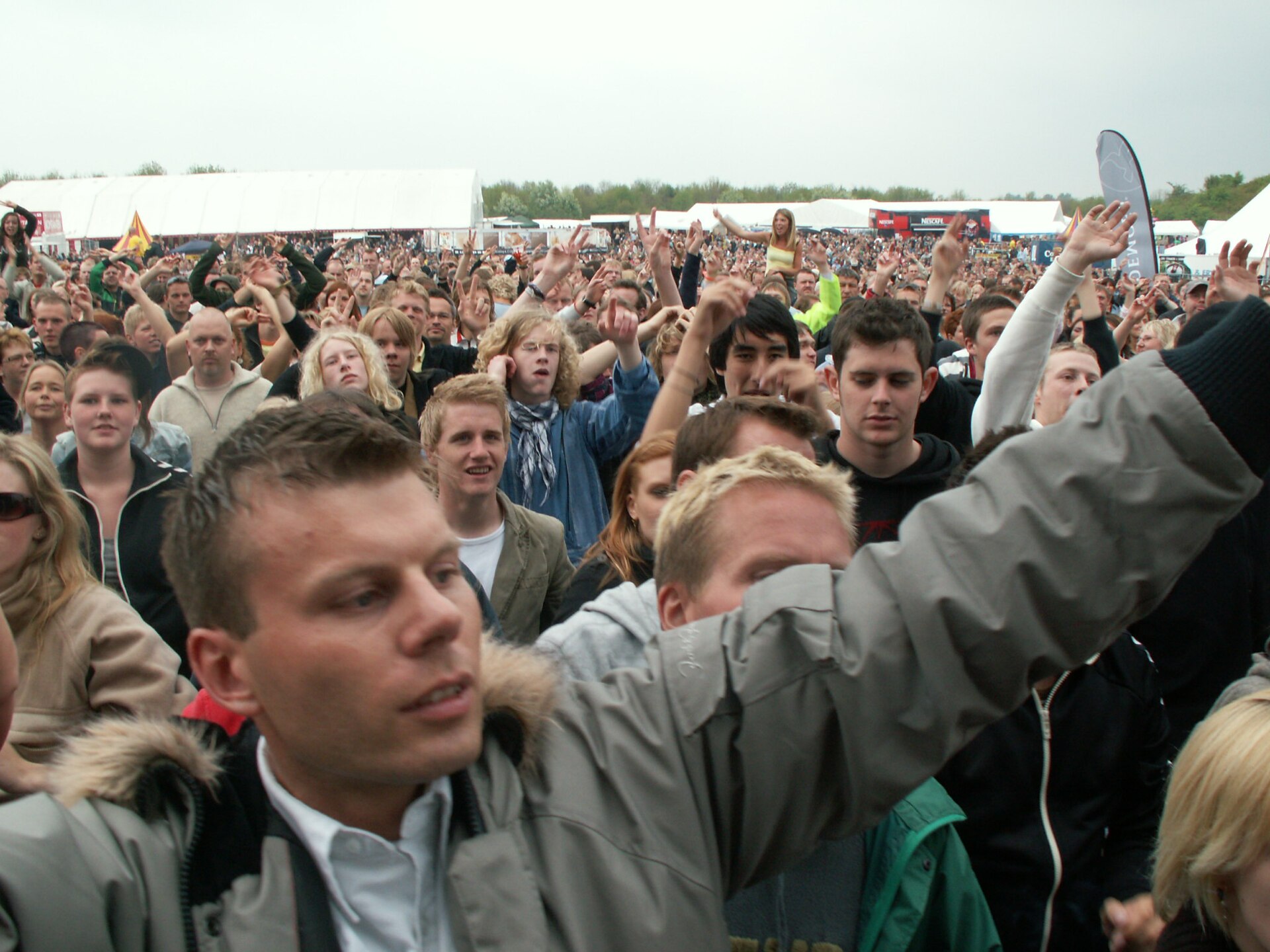 The crowd does the socializing: solo at events, never really alone.